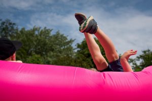 two legs in the air from someone jumping upside down