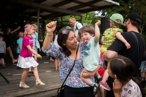 Mom and son raising their hands, smiling